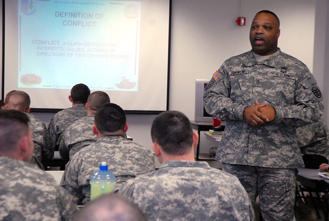 Sgt. 1st Class Aljournal “A.J.” Franklin teaches a conflict management class for soldiers new to the battalion or returning from Cuba earlier this year at Fort Leavenworth.