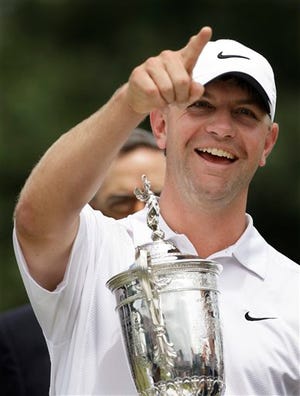 Lucas Glover holds his trophy after winning the U.S. Open Golf Championship.