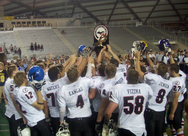 The East All-Stars celebrate with the trophy after winning the U.P. All-Star Game Saturday at the Superior