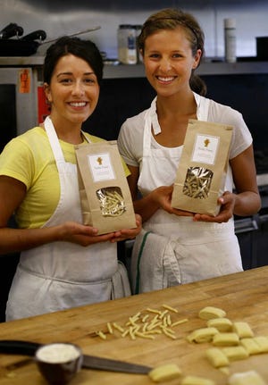 Nella Pasta founders Rachel Marshall, left, and Leigh Foster handcraft pasta like this strozzaperetti at their business’ Pembroke kitchen. 


GREG DERR