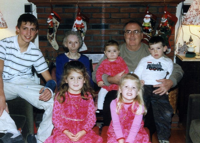 Mary Van Neste, formerly of Milton, former Weymouth teacher at Christmas 2007. Mary is second from left at rear with her husband Phil, and their 5 grandchildren. In the back row, from left to right are Patrick Buell of Duxbury, Mary Van Neste of Falmouth, Agnes Buell of Duxbury, Philip Van Neste, and Michael Van Neste of Falmouth. Front row, seated: Veronica Buell, Nora Buell, both of Duxbury.