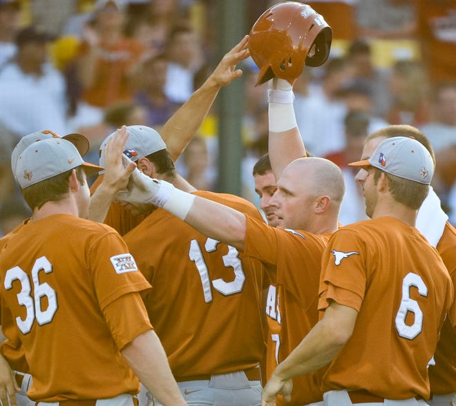 Texas'Preston Clark (center) celebrates his home run against LSU in the second inning of Game 2 of the best-of-three College World Series finals in Omaha, Neb., on Tuesday.