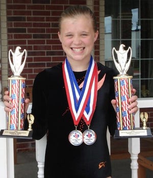 Alli Hagerty of Galva displays two trophies she won at the USTA National Tumbling and Trampoline competition held in Amarillo, Texas the week of June 15. She competed in two events: trampoline and double-mini trampoline. She placed 10th in the sub-avanced 11-12-year-olds on the trampoline and 8th on the double-mini 11-12-year-old intermediate level. There were 108 teams at the event. To participate, Alli had to place in the top 10 at the state competition held in Romeoville in April. Daughter of Todd and Amy Hagerty, she is coached by Sarah Oldeen of Patti’s Gym. That gym will have several area kids competing in August at the the AAU Junior Olympics competition in Des Moines, IA.
