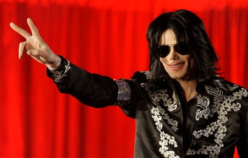 FILE - In this March 5, 2009 file photo, Michael Jackson announces that he is set to play ten live concerts at the London O2 Arena in July, which he announced at a press conference at the London O2 Arena. (AP Photo/Joel Ryan, file)