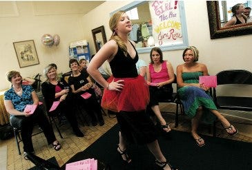 Photo by Daniel Freel/New Jersey Herald Chelsea Martz, of Lotus Designs at Inner Designs, participates in The Main Street Women of Spring Street fashion runway show Wednesday at The SpringBoard Shoppes in Newton. Proceeds from the event, which featured women shop owners, merchants and vendors of Spring Street, will benefit Main Street Newton Inc.