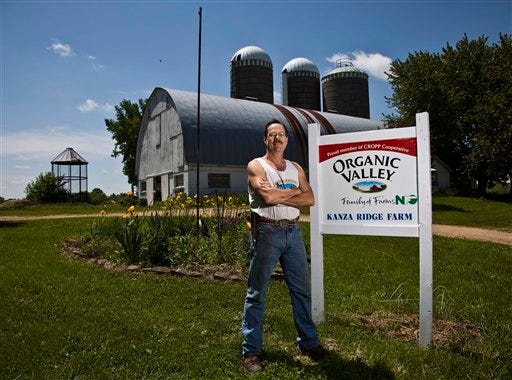 Organic farmer Allen Moody is seen on his farm in Westby, Wis. A growing number of farmers who went all-natural in the years when organic food sales were growing at a double-digit pace are giving up their organic certifications.