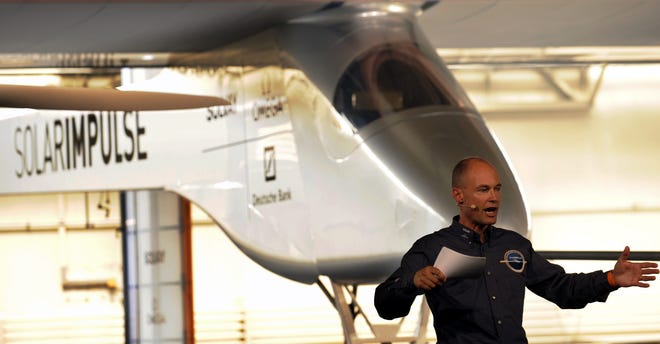 Bertrand Piccard, initiator and chairman of Solar Impulse speaks during the unveiling ceremony of the Solar Impulse HB-SIA, the first solar airplane aiming to fly night and day withhout fuel, on Friday in Duebendorf Airffield, Switzerland.