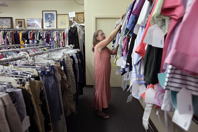 Molly Crowley of Marshfield looks through the clothes on sell at the Sea Chest Consignment shop on Rt. 3A on Tuesday afternoon. Robin Chan photo 2009