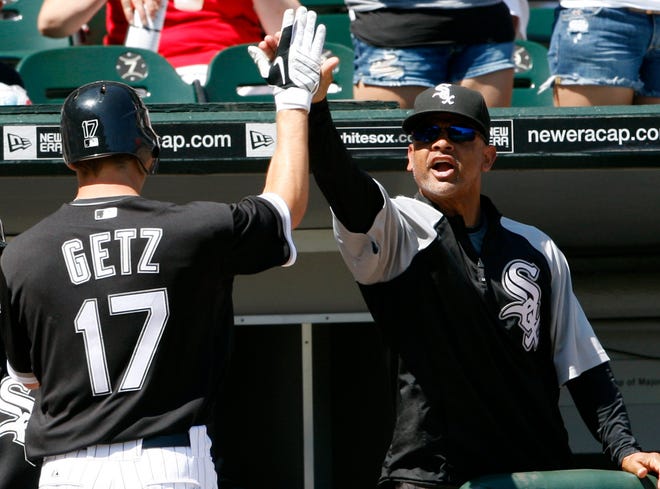 Nam Y. Huh/The Associated Press
The White Sox’s Chris Getz celebrates with bench coach Joey Cora after stealing home in the sixth inning Sunday at U.S. Cellular Field.