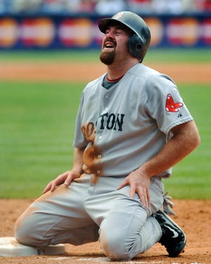 Kevin Youkilis reacts after being forced back to first base on a fielder's choice off the bat of David Ortiz during the ninth inning of the Sox' 2-1 loss on Sunday in Atlanta.