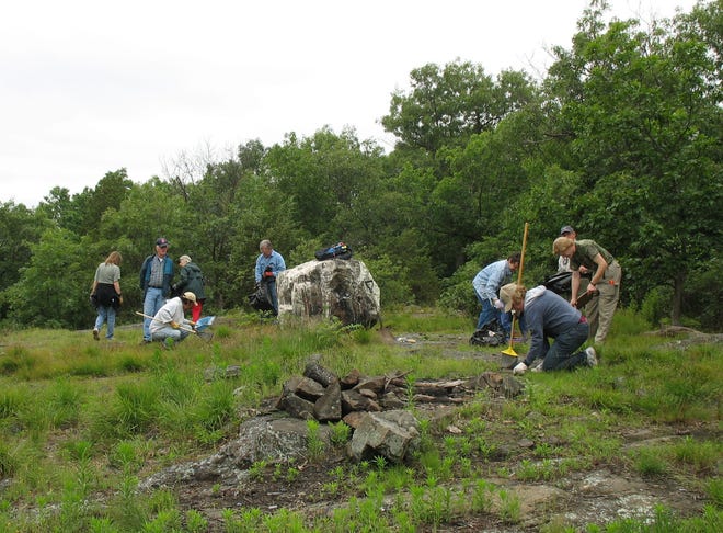 Waltham Land Trust volunteers spend Sunday cleaning Jericho Hill.