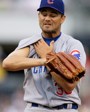 Gene J. Puskar/The Associated Press
Cubs starter Ted Lilly gives up three runs, two earned, in seven innings and strikes out seven.