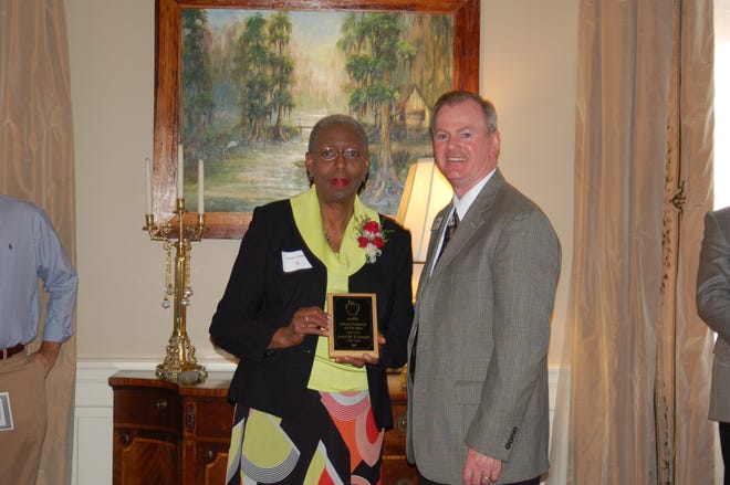 Jessie M.A. Joseph receives her award from Kenneth Jenkins, APEL President Elect.