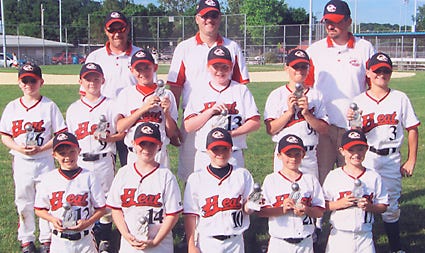 The Quad City Heat boys baseball team, that includes local players took first place in the Muscatine Tournament held June 12 and 13. The team played three games each day and won all six games to win the tournament. Team members include from left, front row Trevor Kane, Dawson Anderson, Justin Angelo, Travis Kane and John Poppy, middle row,?Tony Barreca, Nick Drobrushevich, Rickey proehl, Ray Thrapp,?Ian Bedell and Connor Bedell and back row, coaches Mitchell Proehl,?Dan Bedell and Shae Drobrushevich.