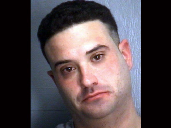 Michael Joseph Tooker, 30, is charged with first-degree burglary and communicating threats.