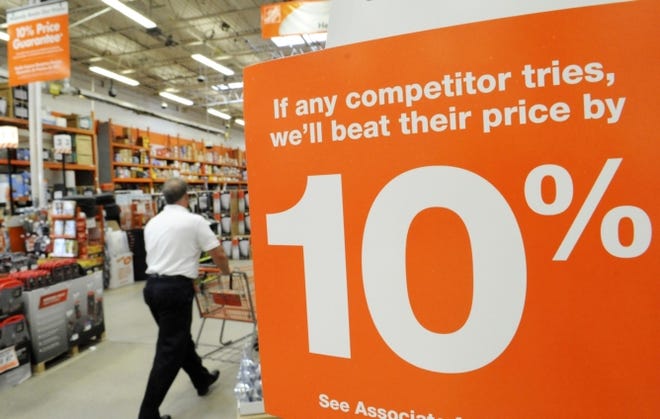 A shopper makes his way through Home Depot in Danvers, Mass. A trade group's measure of the health of the U.S. services sector contracted less than expected in June, reaching its highest level in nine months.