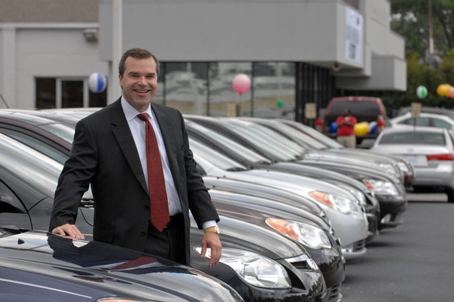 Mark E. Medinger stands among a row of brand new Hyundais on his Abercorn Street car lot. Medinger's Savannah Dodge was one of the hundreds of dealerships recently closed by Chrysler Corp. He opened his business Friday as Savannah Hyndai. (John Carrington/Savannah Morning News)
