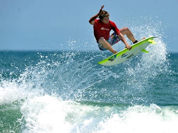 Mike Losness of California shows some tricks during the Tow At competition Saturday afternoon of the 2009 Reef Sweetwater Pro Am Surf Competition.
