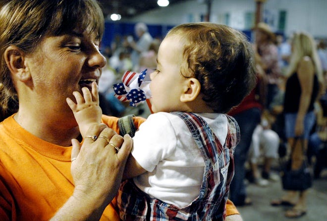 Rylan Suhrbier gets a hug from his grandmother after winning in the infant division of last year’s Boys Baby Contest.