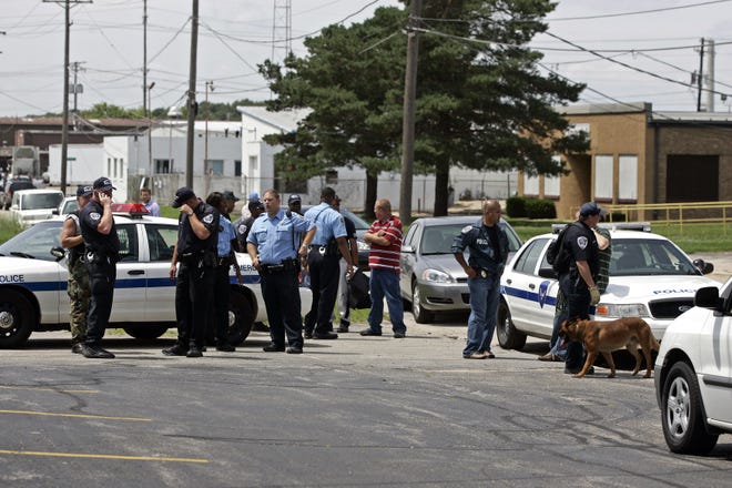 Rockford police investigate Thursday, July 16, 2009, the area where a suspect in a double homicide was captured at Future Tool Inc. on 23rd Avenue in Rockford.