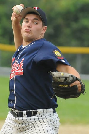 Natick Legion's Chris Funnell unleashes a pitch against Ashland last night.