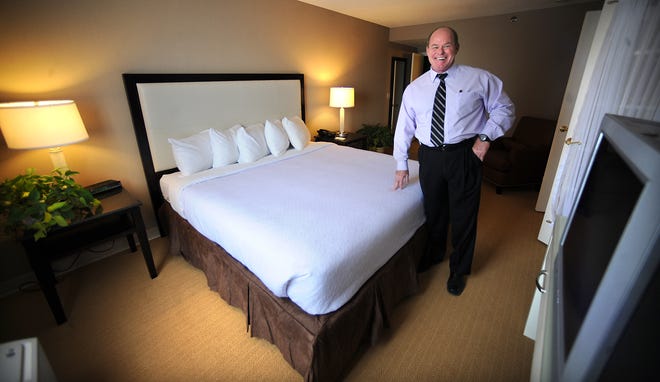 D.C. Caldwell, general manager the Holiday Inn in Marlborough, stands in a renovated suite.