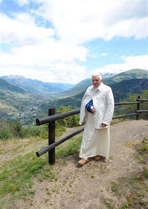 Pope Benedict XVI walks in the Italian Alps in Les Combes, near Aosta, northern Italy, Saturday, July 18, 2009. Pope Benedict XVI was hospitalized, Friday, July 17, 2009, after he broke his right wrist in a fall during his vacation in the Italian Alps. The Pope, 82, fell in his room in a chalet overnight and despite the accident, celebrated Mass and had breakfast before going to the hospital, a Vatican statement said.