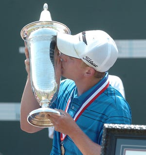 Brad Benjamin kisses the championship trophy after winning the USGA Amateur Publinks golf tournament at the University of Oklahoma's Jimmie Austin Golf Course Saturday, July 18, 2009 in Norman, Okla.