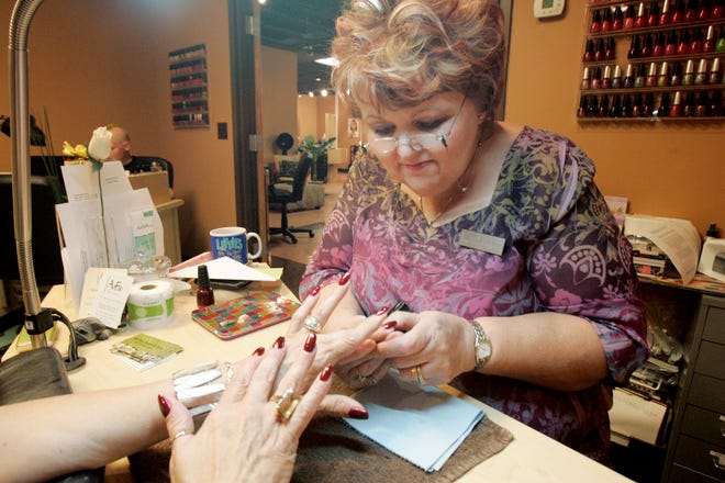 Nail technician Brenda Skermont gives a manicure to Faustine Kenerson of Rockford on Thursday, July 16, 2009, at AbFab Salon & Spa Inc. in Rockford.