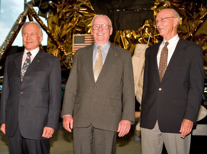 Buzz Aldrin, Neil Armstrong and Maj. Gen. Michael Collins stand in front of a lunar module device at the Smithsonian National Air and Space Museum in Washington on Sunday.