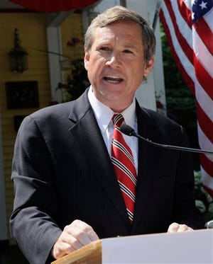 U.S. Rep. Mark Kirk, R-Ill., left, announces his candidacy for U.S. Senate during a news conference outside his boyhood home in Kenilworth, Ill., Monday July 20, 2009. (AP Photo/David Banks)