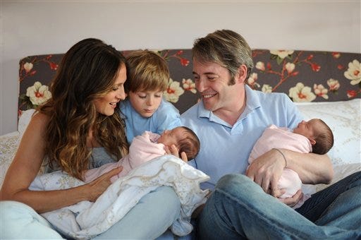 In this first official photo of twin daughters provided by Robin Layton, actors Matthew Broderick, right, Sarah Jessica Parker, left, and their son James Wilkie Broderick pose with their new daughters Marion Loretta Elwell Broderick, left, and Tabitha Hodge Broderick on Monday, June 29, 2009, in New York. The girls were born Monday June 22, 2009.