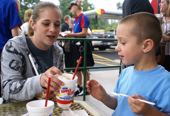 Virginia Schwarz, 24, gives her son, Jayden Holby, 5, a taste of a Sonic treat Tuesday, July 21, 2009, at the new Sonic Drive-in Restaurant in Belvidere during the restaurant’s VIP event and ribbon-cutting.