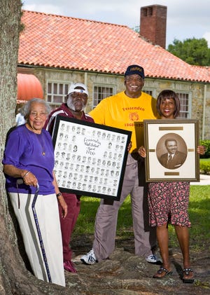 From left, Lois B. Miller, a 1932 graduate of Fessenden Academy; Fessenden High School alumni James A. Collins, Class of 1966; Whitfield Jenkins, Class of 1959, and Beverly Braxton, Class of 1966, pose in front of what is now Fessenden Elementary School northwest of Ocala.