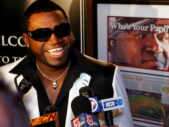 David Ortiz talks to the press during his grand opening of Big Papi's Grille, Thursday night on Rte. 9 in Framingham.