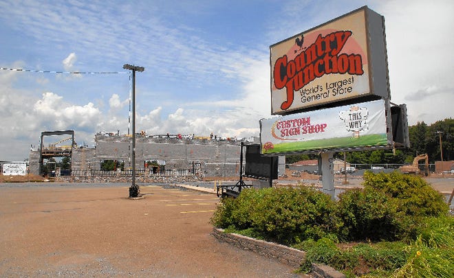 A construction crew works on a building at the Country Junction in Lehighton. The original retail complex was destroyed by fire in October 2006.
