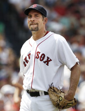 John Smoltz reacts after giving up a run in the fourth inning of the Red Sox' 6-2 loss to the Orioles.