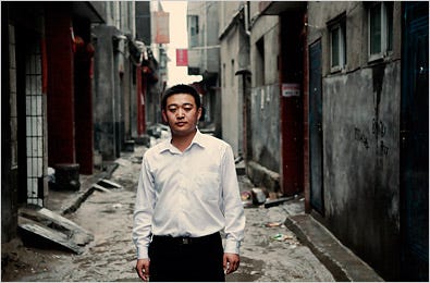Xue Longlong, on the street where he lives in Xian, China. When his academic records vanished in Wubu, he lost out on a high-paying job, and the woman he hoped to marry abandoned him.