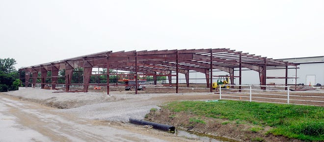 The reconstruction of the Sapp building at the Boone County Fairgrounds is at a standstill because some metal siding needed for the project was accidentally taken from the site.