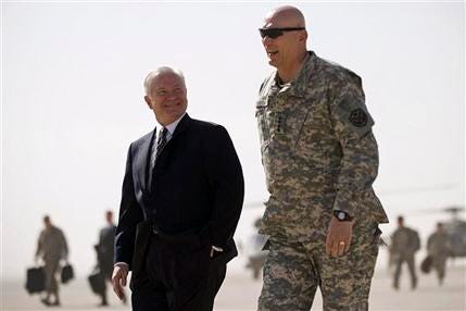 U.S. Defense Secretary Robert Gates, left, walks to his plane with the top US commander in Iraq, Gen. Ray Odierno as he prepares to depart Baghdad to Irbil, in Baghdad, Iraq, Wednesday, July 29, 2009. Gen. Ray Odierno identified the tension in northern Iraq as the number one driver of instability.