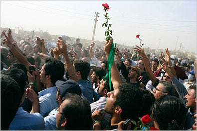 This photo obtained by The Associated Press shows protesters chanting slogans at an opposition rally at the Behesht-e-Zahra cemetery outside Tehran on Thursday. Iran has banned the foreign media from covering protests.