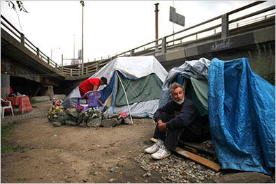 Timothy Webb, 49, left, and Bruce, 59, live in a tent city, dubbed Camp Runamuck, in Providence, R.I., under an overpass stretch of Route 195 that is scheduled for demolition.