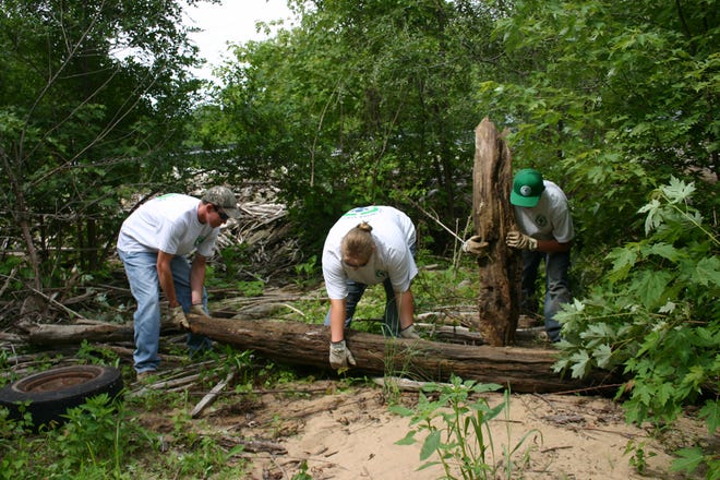 Ray Fitzpatrick / Times correspondent
From left, crew leader T.D. VanMiddlesworth and Youth Conservation Corps members Ronelle Chapman and Chris Miller clean up downed trees and washed-up foliage at the Chautauqua National Wildlife Refuge near Havana. Members of the YCC program, offered by the U.S. Fish and Wildlife Service, spend the summer gaining experience in the conservation field while helping care for the Illinois River National Wildlife and Fish Refuges.