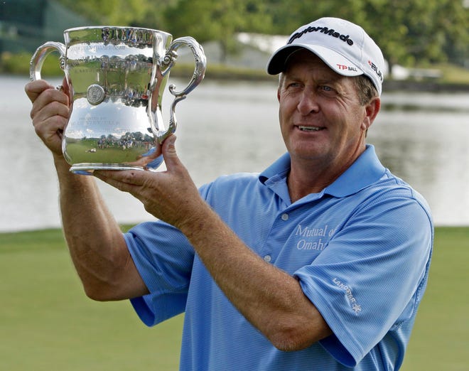 Darron Cummings/The Associated PressFred Funk holds the championship trophy after winning the U.S. Senior Open golf tournament Sunday in Carmel, Ind.