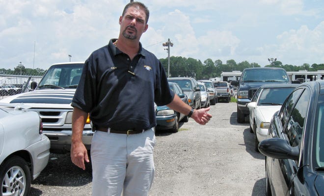KEVIN TURNER/Times-UnionDuval Ford employees have burnt the midnight oil submitting Cash For Clunkers documentation on around two dozen autos to the government, said dealership president and COO Dale Murray.
