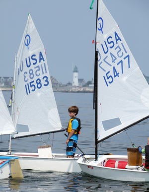 Peter Duncan of the Plymouth Yacht Club maneivers his Optimist during the USA Junior Olympic Sailing Festival/Scituate Junior Regatta.