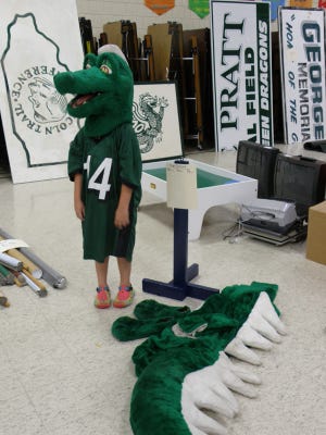 The Aledo Green Dragon mascot outfit will be sold Saturday, Aug. 8, at the Apollo Elementary gymnasium sale with a silent auction.