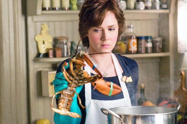 Amy Adams handles a lobster as Julie Powell in Nora Ephron’s “Julie & Julia.”