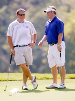 Jordan Cox and Scott Belcher laugh together on the 10th green August 8, 2009 at The Rail Golf Course in Sherman during the third round of the Men's City Golf Tournament. Ted Schurter/The State Journal-Register