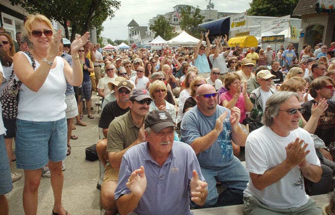 A crowd listens to music during Sunday’s annual Scituate Heritage Days Festival along Scituate Harbor on Sunday.